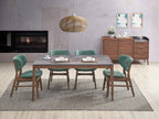 Contemporary 5-piece walnut dining set with faux marble table and green chairs, perfect for modern interiors with a cozy fireplace backdrop.