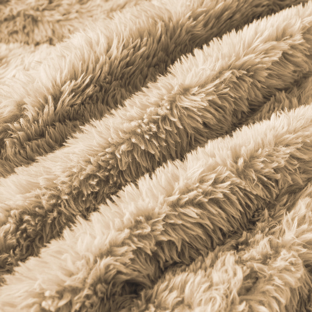 Detailed view of fluffy plush fabric in light khaki, emphasizing the sofa's cozy and high-quality upholstery material.