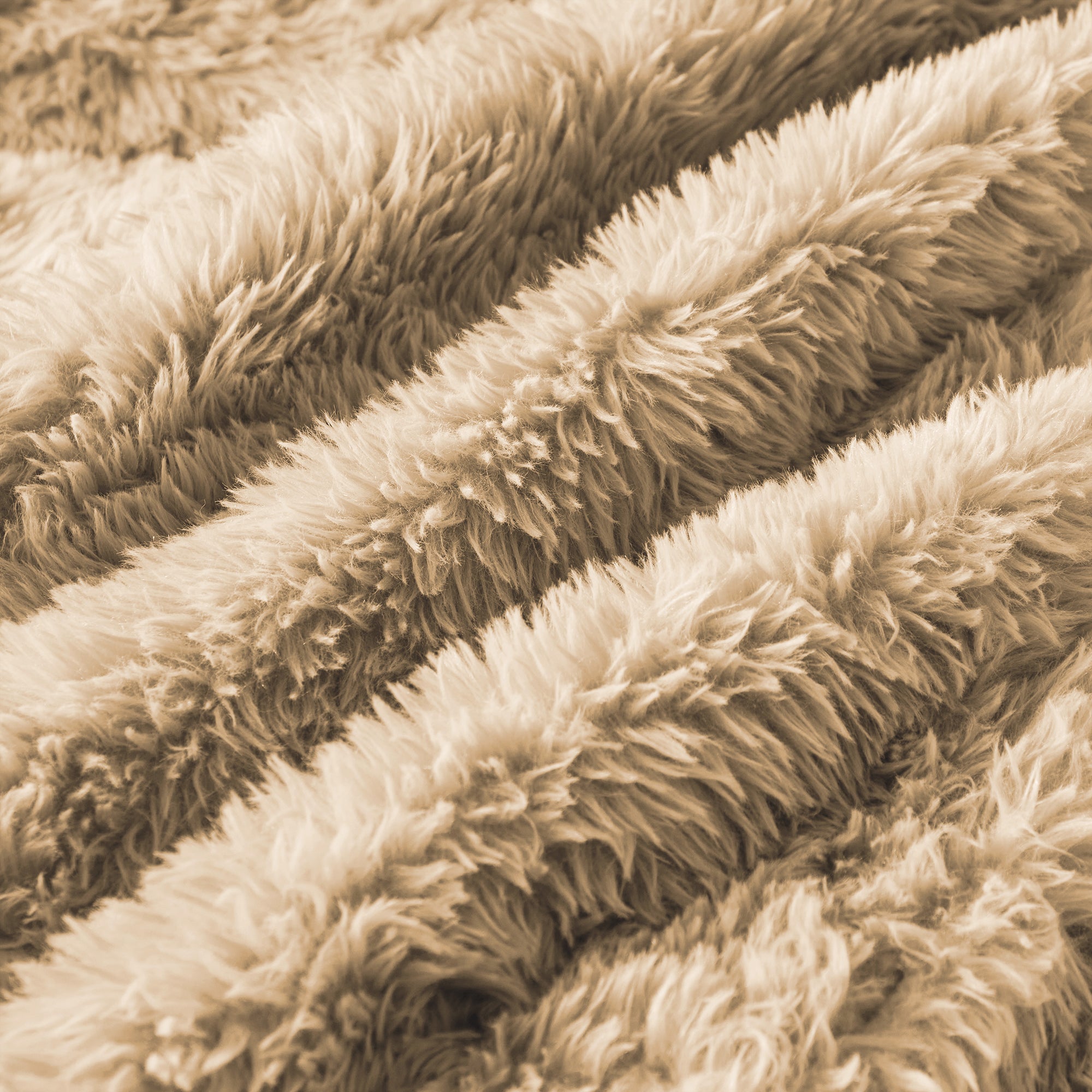Detailed view of fluffy plush fabric in light khaki, emphasizing the sofa's cozy and high-quality upholstery material.