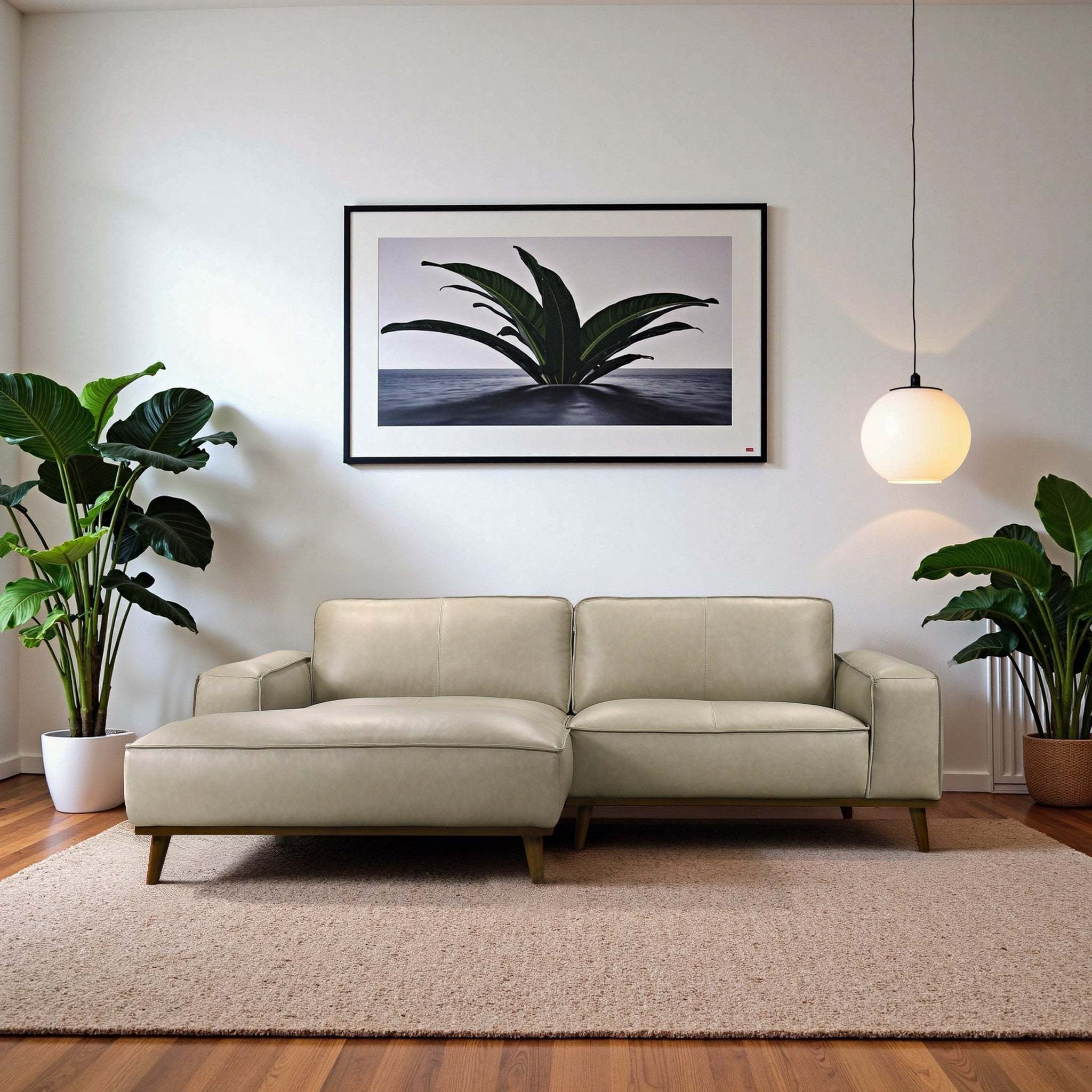 Modern beige leather left-facing sectional sofa with a sleek, minimalist design and tapered wooden legs.