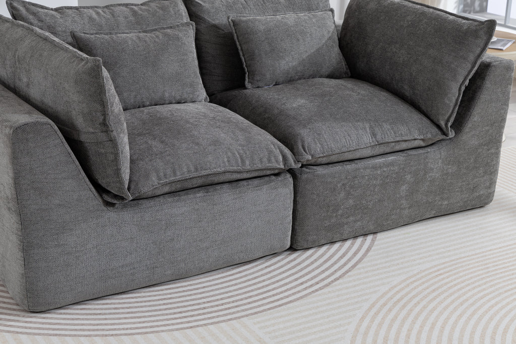 Detailed view of the Cloud Couch cushions and seat structure, showcasing plush comfort and soft velvet texture.