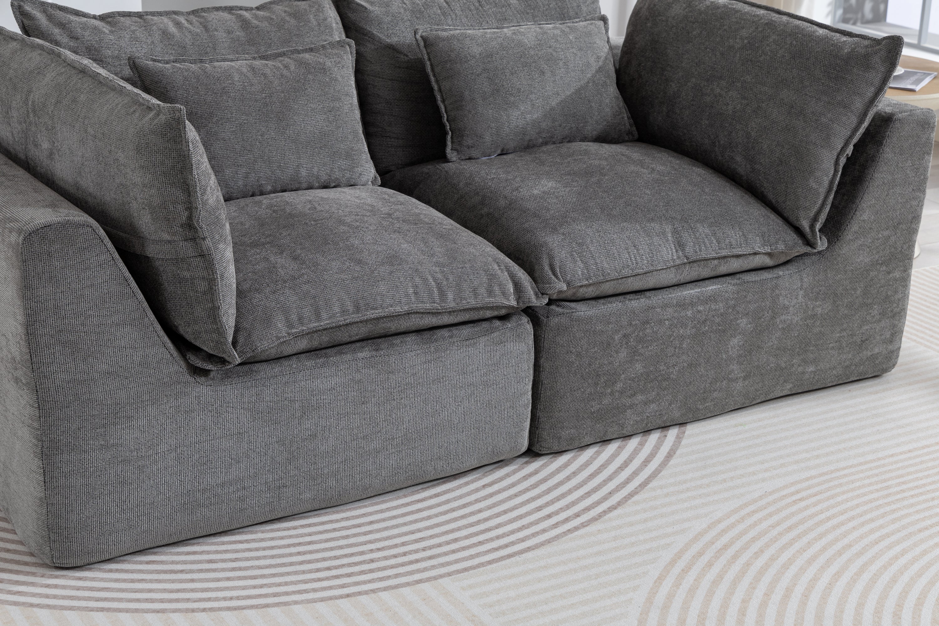 Detailed view of the Cloud Couch cushions and seat structure, showcasing plush comfort and soft velvet texture.