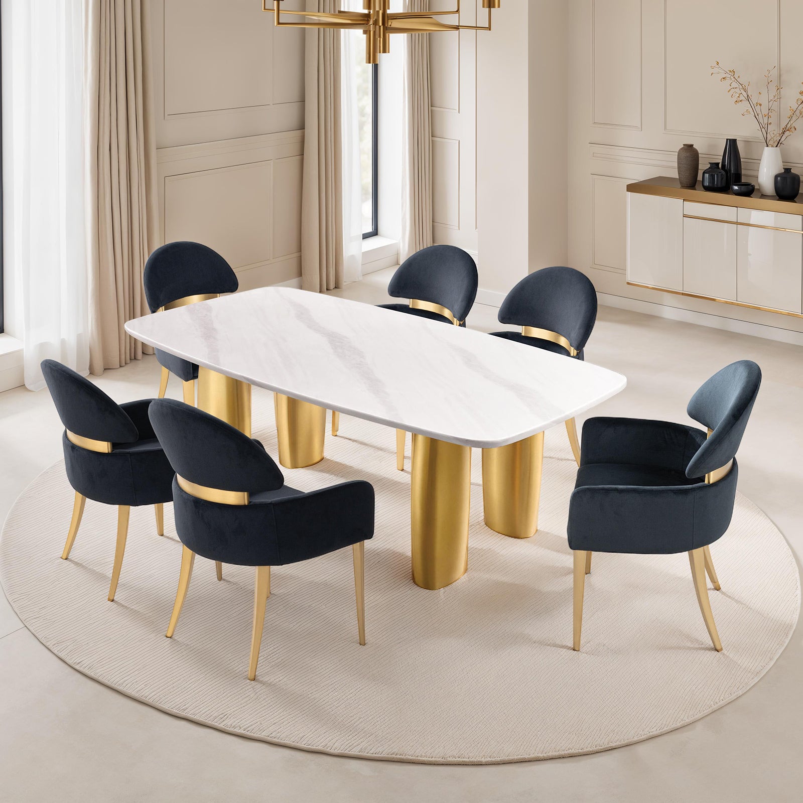Modern dining room setup with six black dining arm chairs and a white marble table, featuring matte gold legs for a luxurious look.
