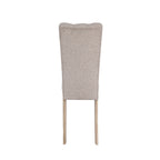 Back view of Modern Beige Dining Chair showcasing curved tufted backrest and sturdy rubberwood construction.