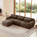 Chocolate plush modular sofa with movable ottoman in a bright living room, featuring a non-slip design and three-seat configuration.
