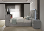 Side view of Gray Sherpa Bed featuring LED-lit headboard, TV stand, and Bluetooth speakers in a minimalist modern room.