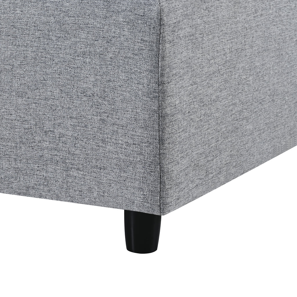 Leg and corner base of 130' U-Shaped Sectional Sofa, featuring sturdy black legs and tightly woven gray chenille fabric.