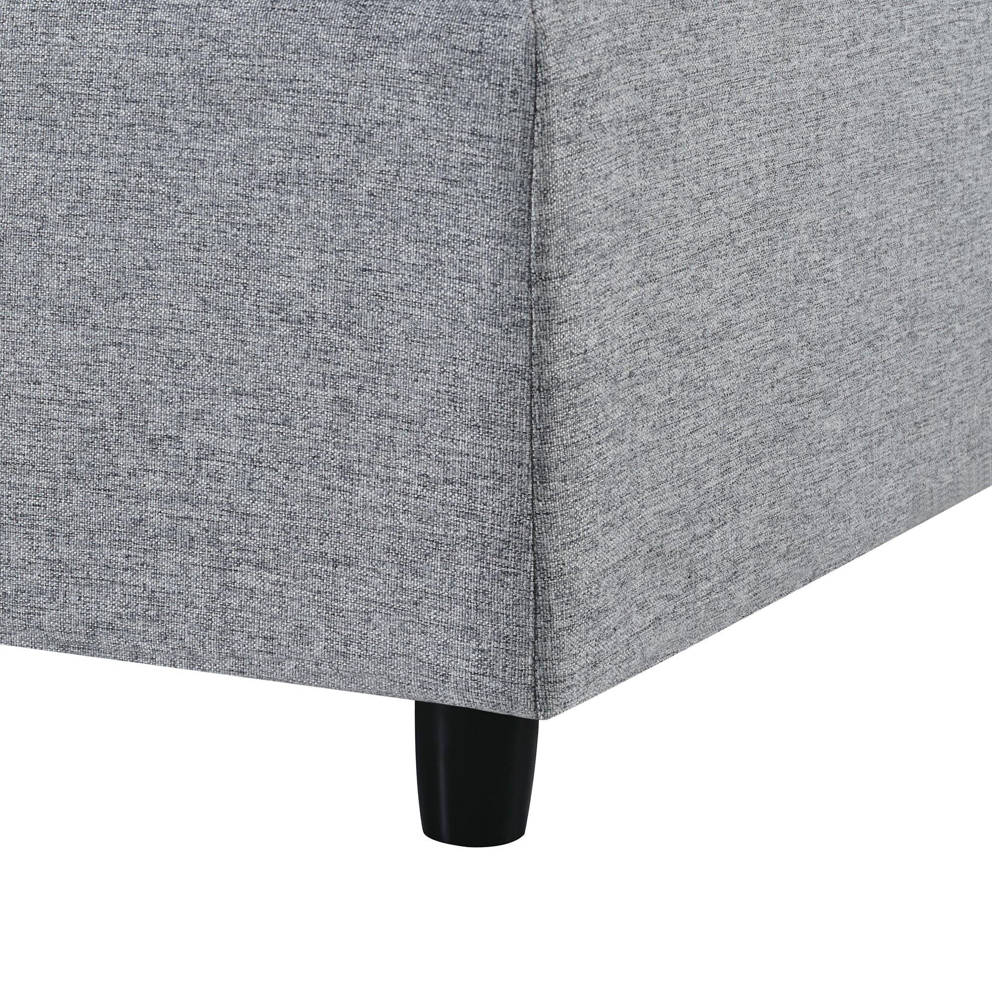 Leg and corner base of 130' U-Shaped Sectional Sofa, featuring sturdy black legs and tightly woven gray chenille fabric.
