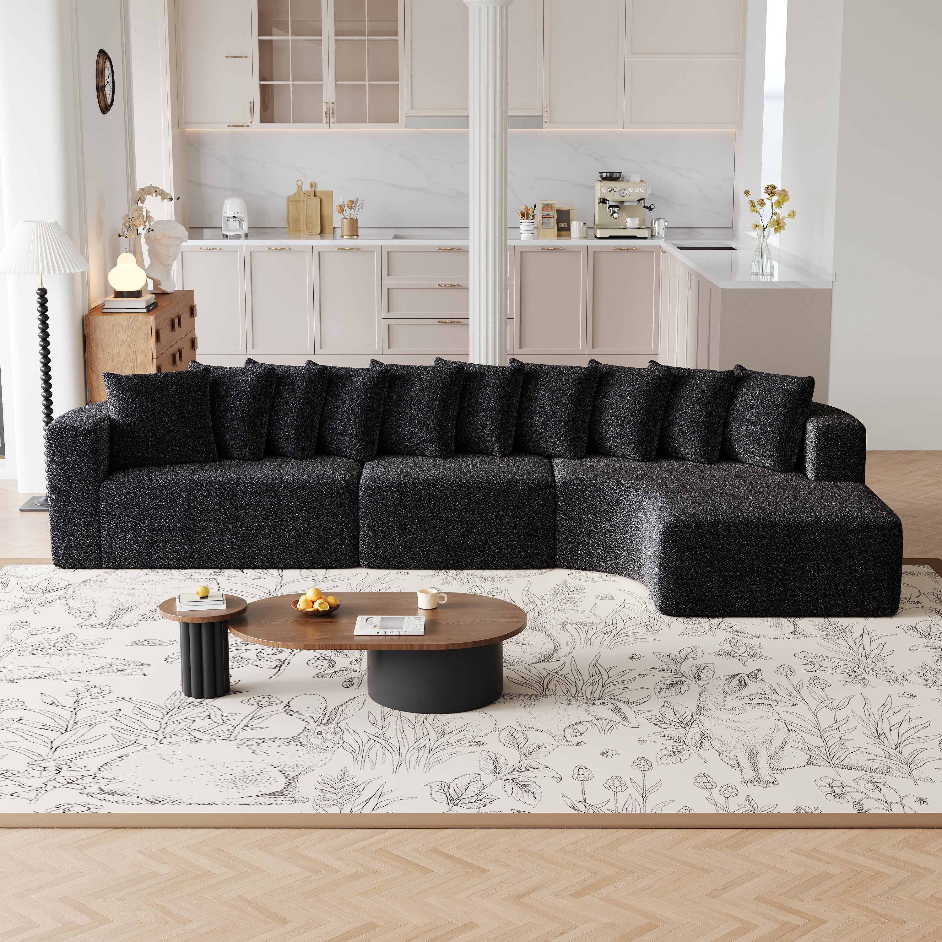 Chenille Sectional Sofa - Modular L-Shaped Sofa in black with 10 pillows, placed in a modern living room with light wood flooring and floral rug.