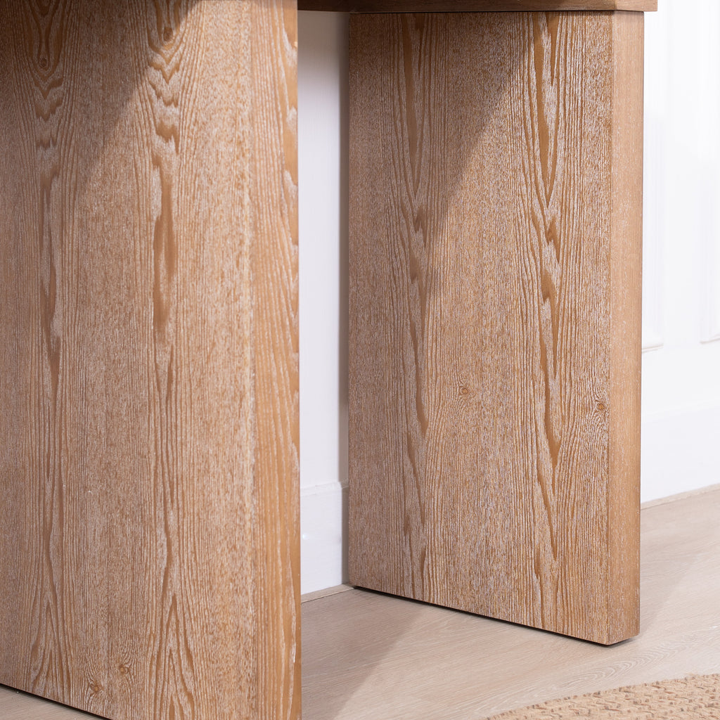 Detailed view of the Rustic Archway Console Table's leg panels, emphasizing the natural wood grain texture.