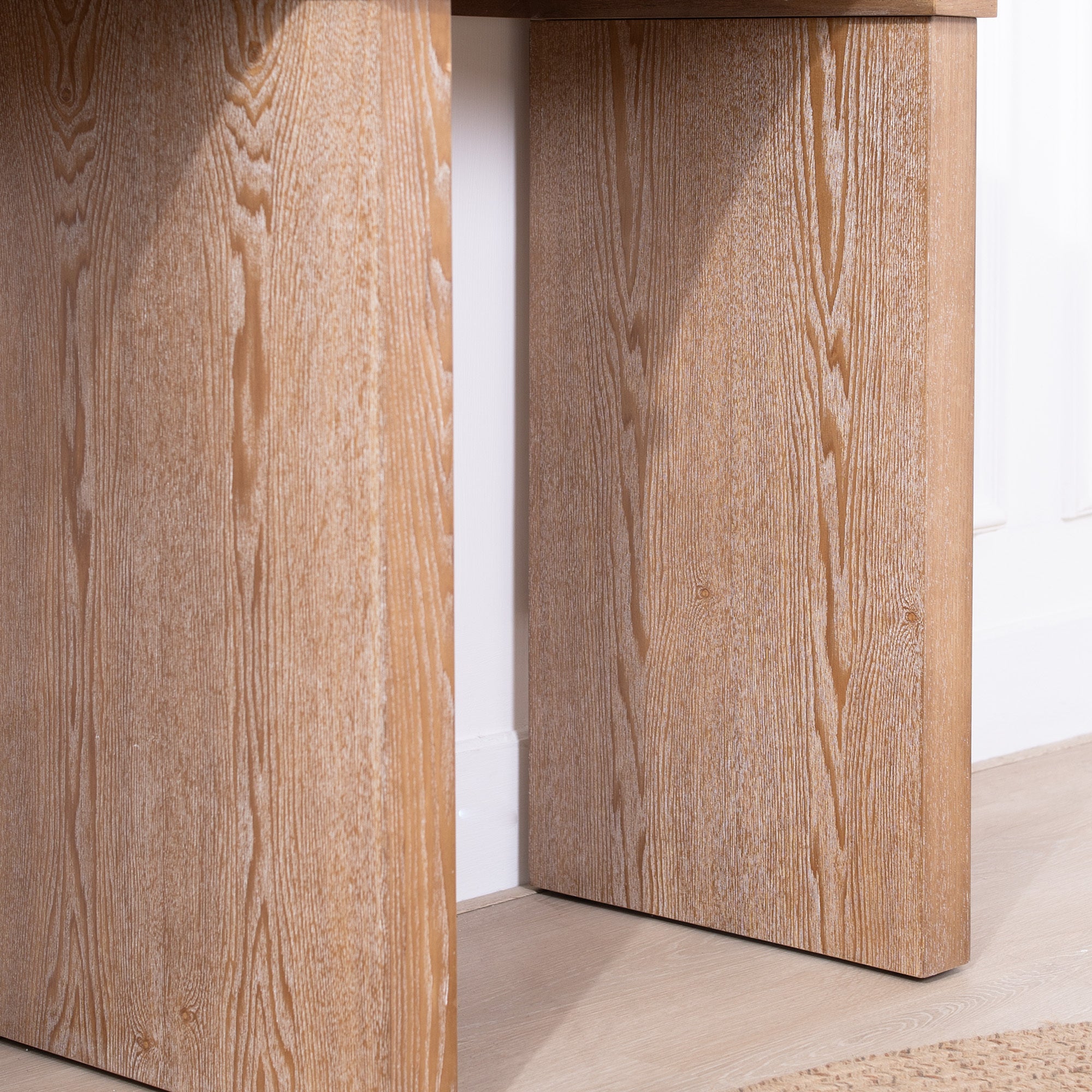 Detailed view of the Rustic Archway Console Table's leg panels, emphasizing the natural wood grain texture.
