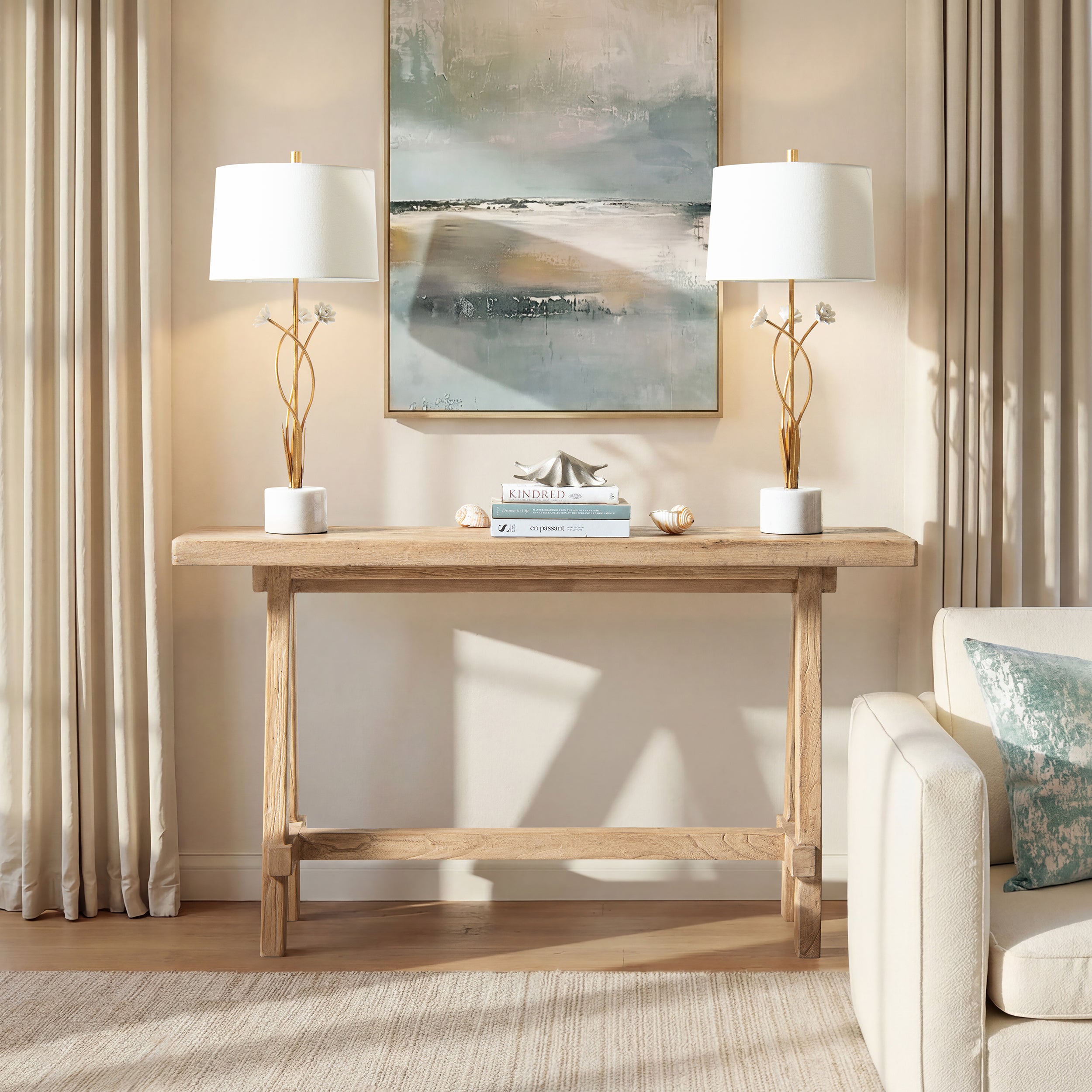 Heritage light natural brown reclaimed elm trestle console table with a rustic, minimalist design.