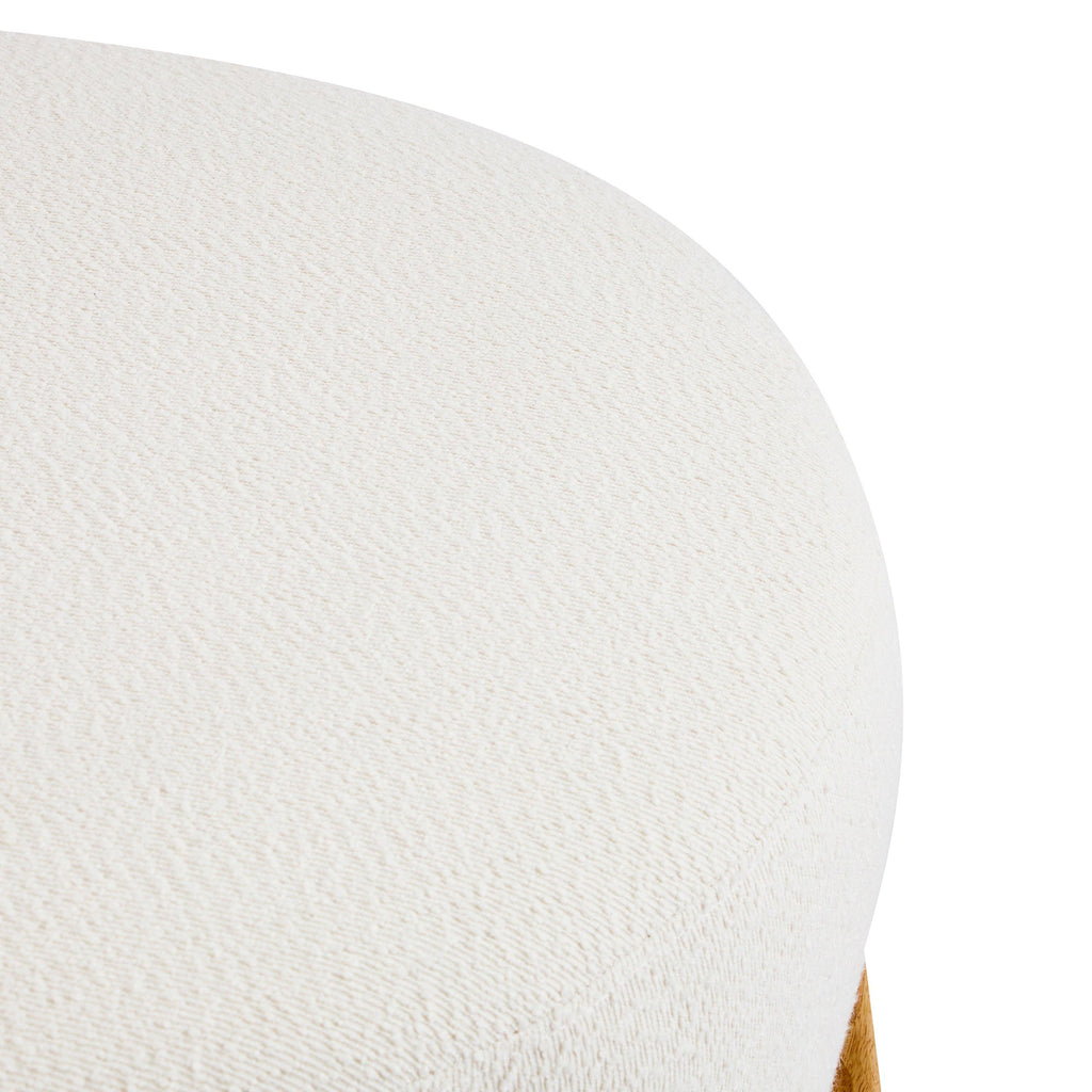 Modish Round Ottoman with Boucle Top and Natural Wood Legs.