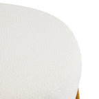 Modish Round Ottoman with Boucle Top and Natural Wood Legs.