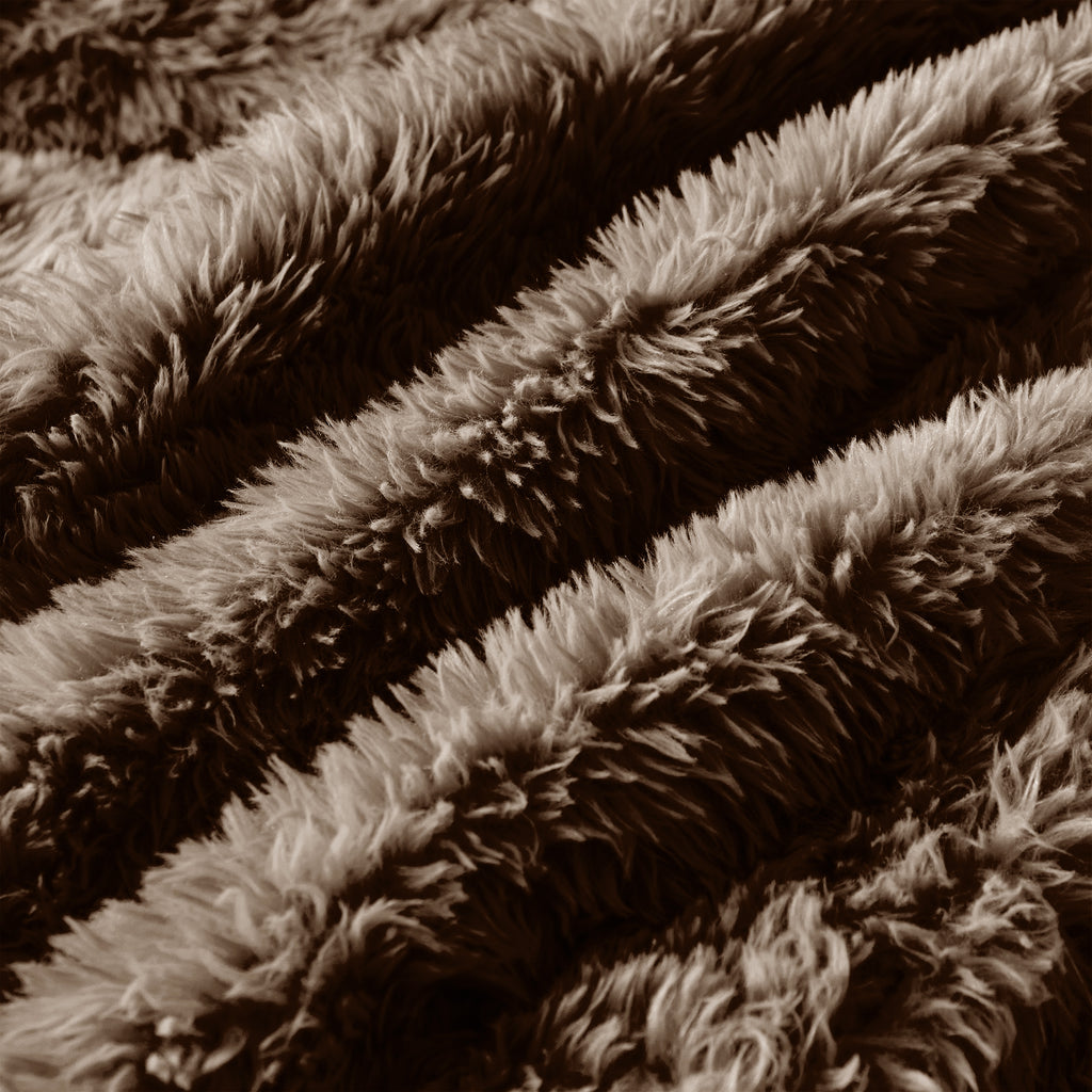 Close-up of chocolate plush fabric texture on 114'' modular sofa, showing thick, soft fibers for luxurious comfort.
