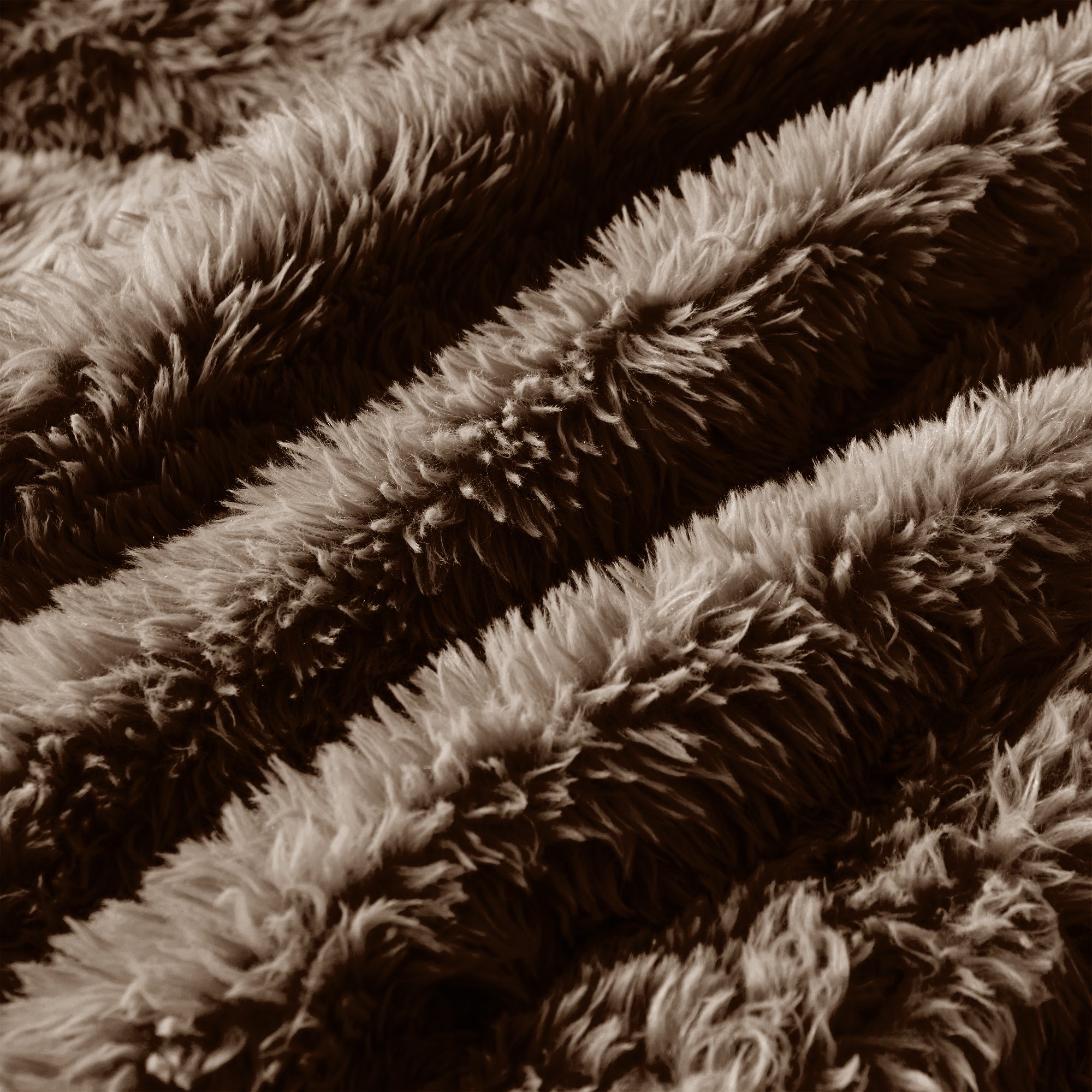 Close-up of chocolate plush fabric texture on 114'' modular sofa, showing thick, soft fibers for luxurious comfort.