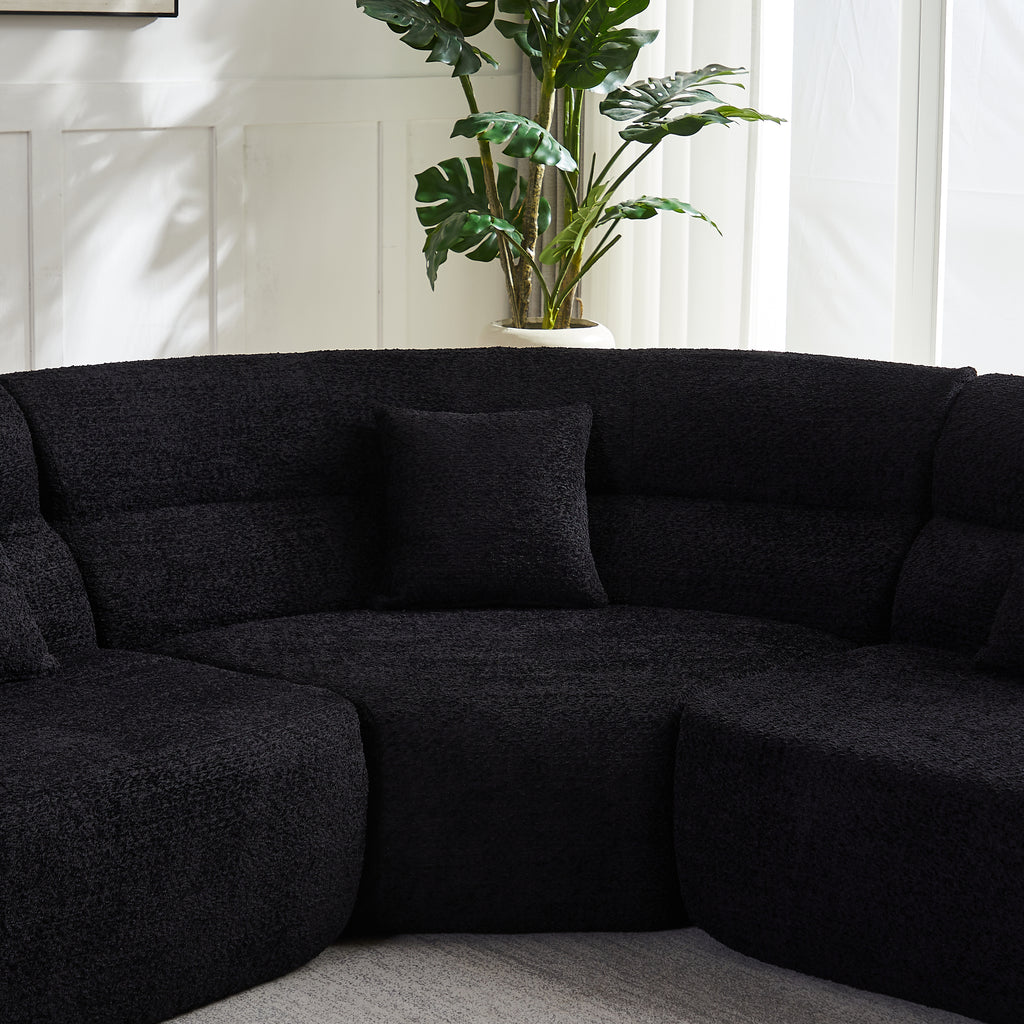 Modern Black Modular Sofa - Luxury Chenille 4-Seater with curved 123.2-inch design, plush backrest and pillow in a bright living room.