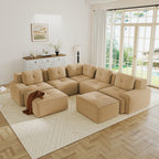 Camel corduroy V-shaped modular sectional sofa with tufted cushions, pearl piping, and two matching ottomans.