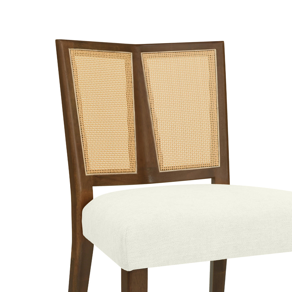 Close-up of rattan backrest on mid-century dining chair, showcasing woven texture and angled wood frame design.