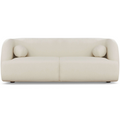 Modern white boucle sofa with curved silhouette, two round bolster pillows, and subtle wood legs.
