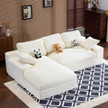 Compressed Corduroy Sofa in white with 3 back cushions and 2 pillows, shown in a cozy living room with plush toys on top.