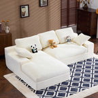 Compressed Corduroy Sofa in white with 3 back cushions and 2 pillows, shown in a cozy living room with plush toys on top.