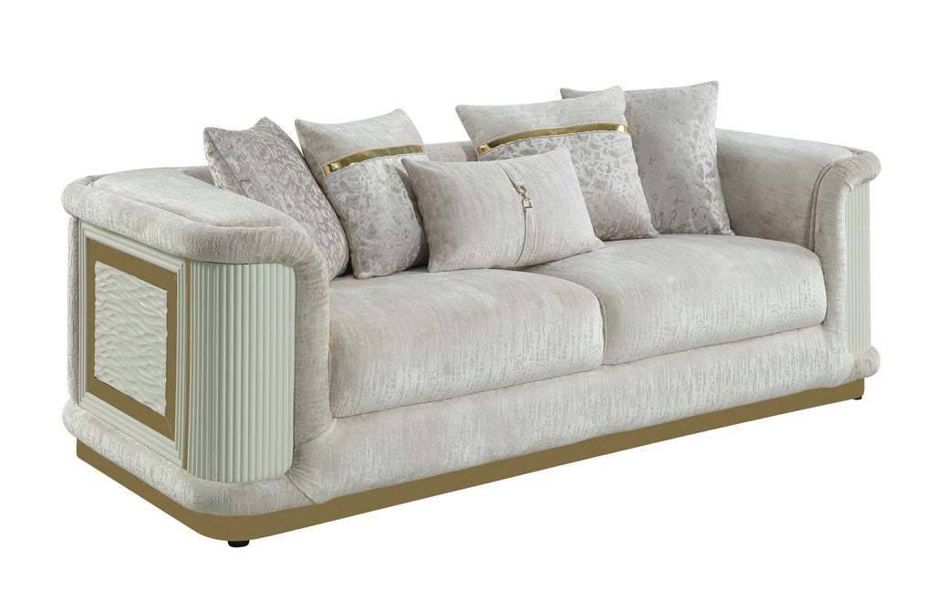 Contemporary beige sofa with gold-accented frame, textured fabric, side panels, and decorative throw pillows.
