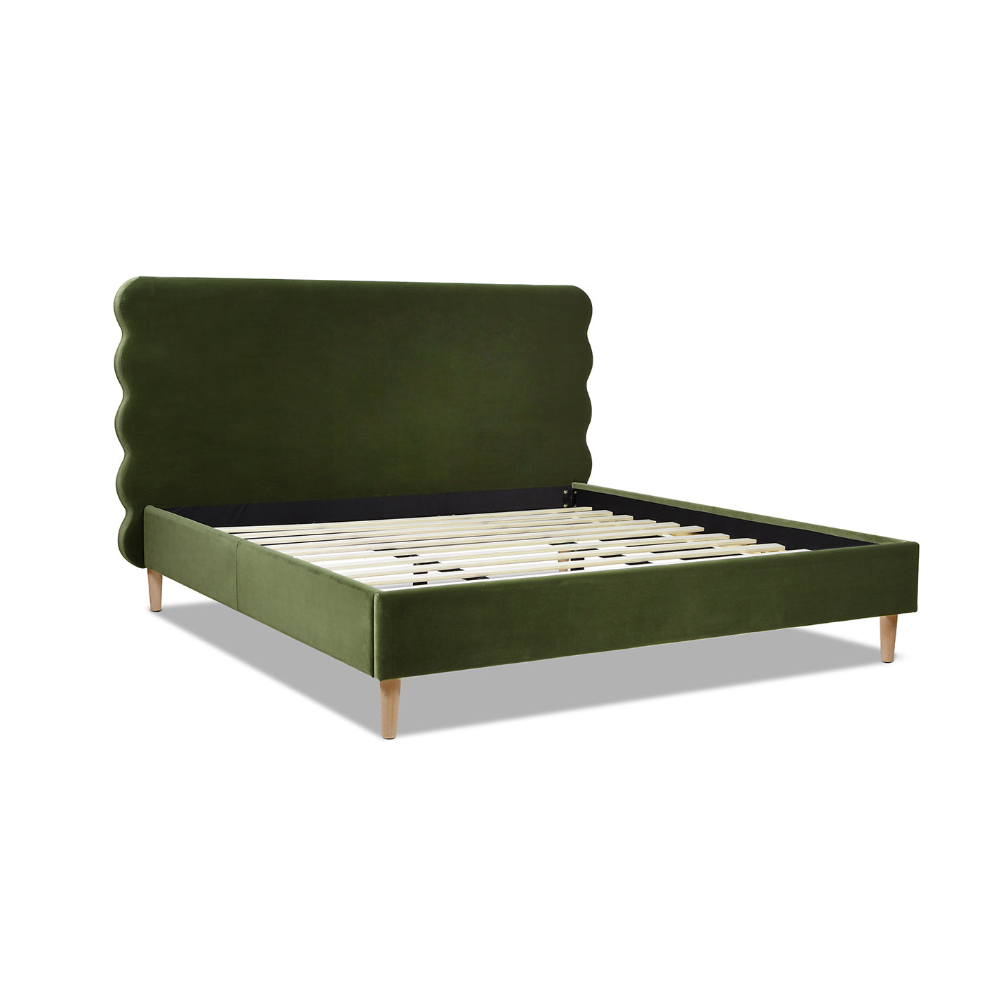 Angled view of the king size Stockholm Modern platform bed in olive green velvet with wavy headboard and wood slats.