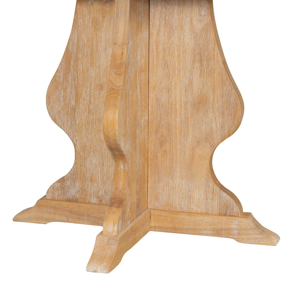 Detailed view of the pedestal base of the rustic farmhouse dining table, highlighting its carved wood design.