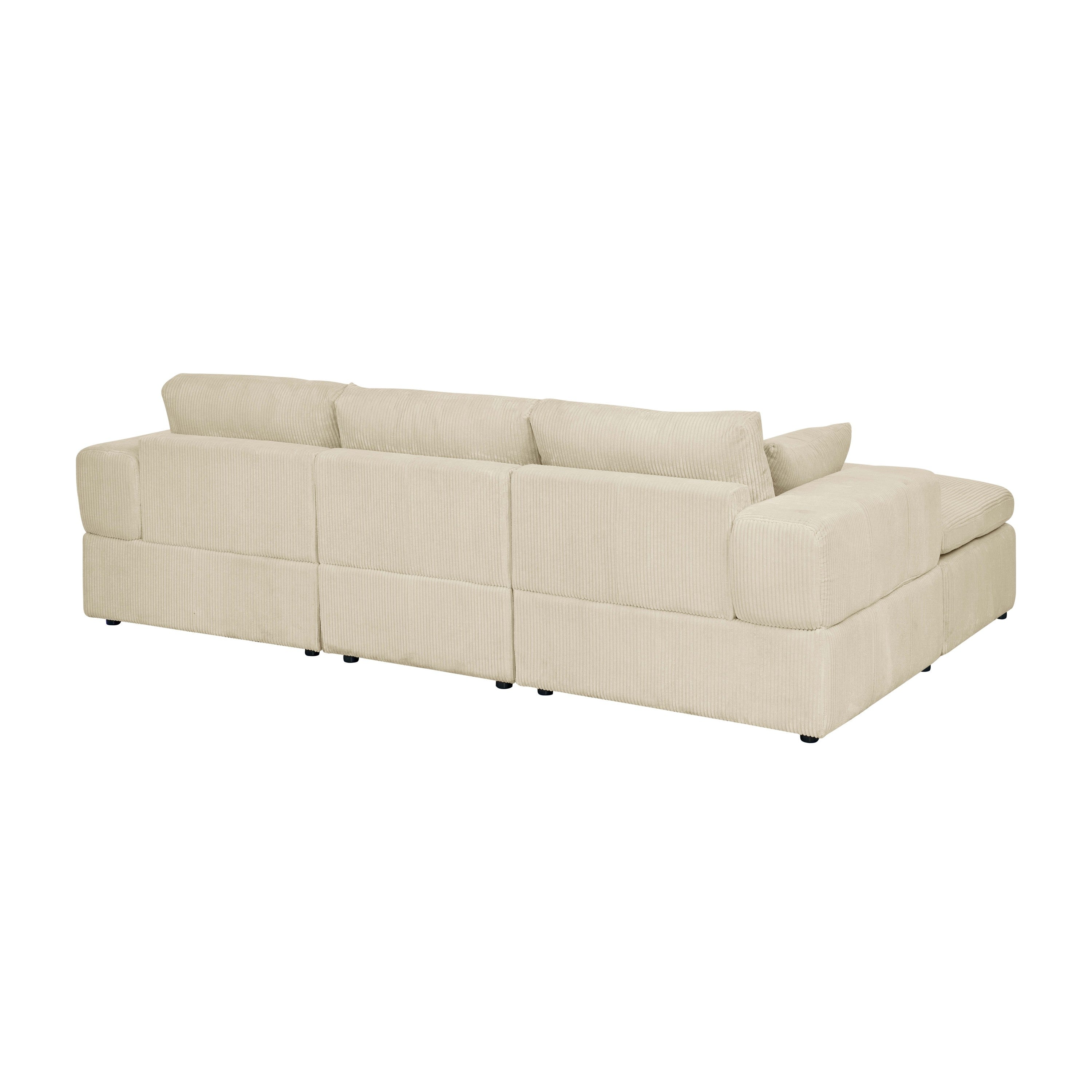 Rear view of beige corduroy sectional sofa with large arms. Modular sections allow for easy configuration and room placement.