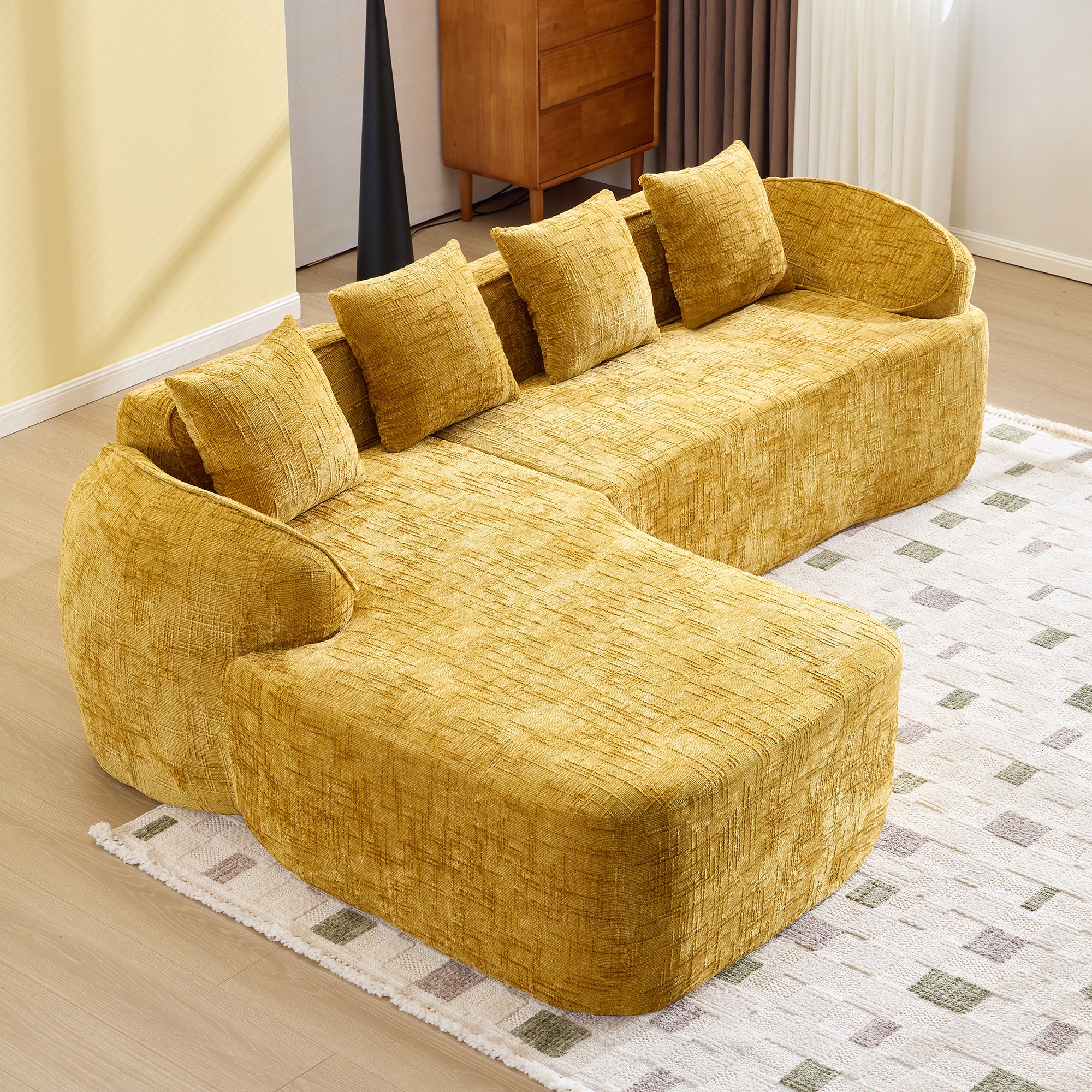 Top view of yellow chenille L-shaped sofa showing plush seating and curved design, ideal for stylish and functional living rooms.