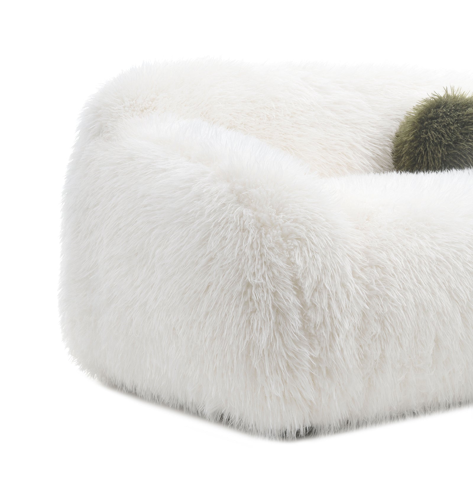 Side angle of Contemporary White Swivel Chair with green ball pillow. Rounded edges and faux fur offer plush comfort and modern appeal.