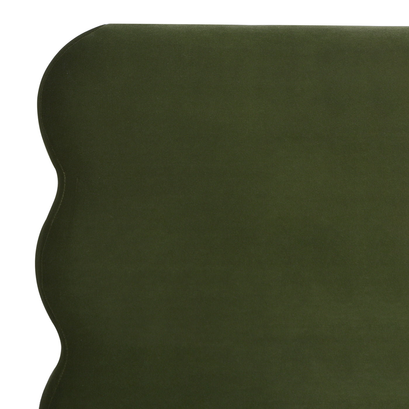 Detailed view of the upper corner of the olive green wavy headboard on the Stockholm Modern king platform bed in velvet fabric.
