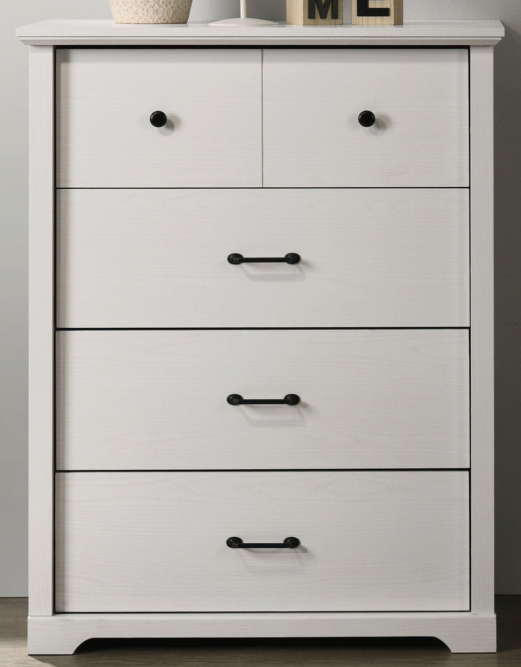 Elara White 4-Drawer Chest with Black Metal Handles.