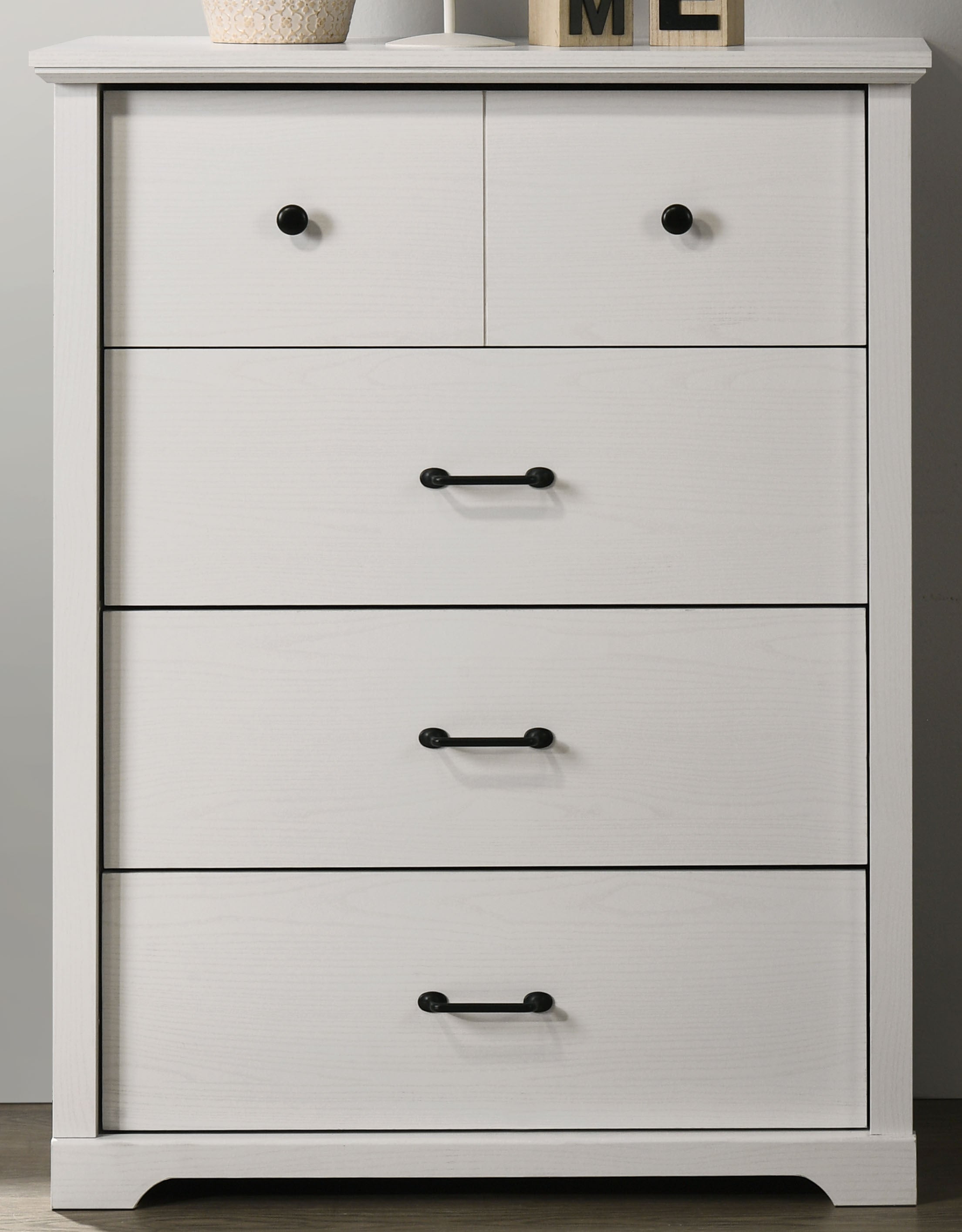 Front view of Elara White 4-Drawer Chest showcasing two small top drawers and three spacious lower drawers with black metal handles.