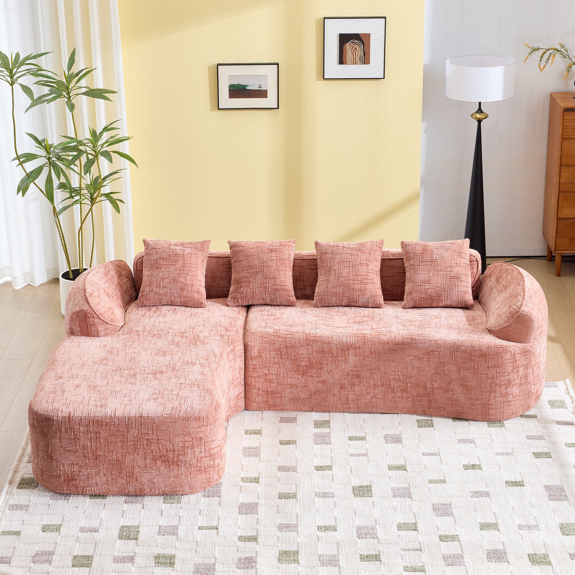 Front view of Pink Chenille L-Shaped Sofa - Fits Any Room | Compressed, featuring plush seating and modern design on a patterned rug.