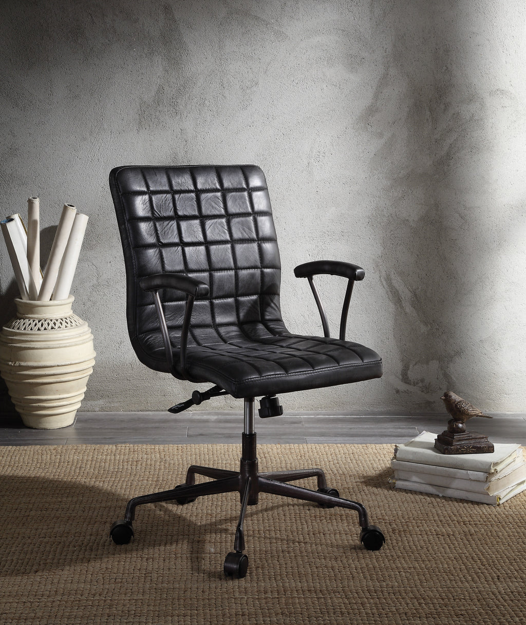 Barack Black Leather Chair - Office Seating with padded seat and backrest, swivel base, and aluminum frame in a modern workspace setting.