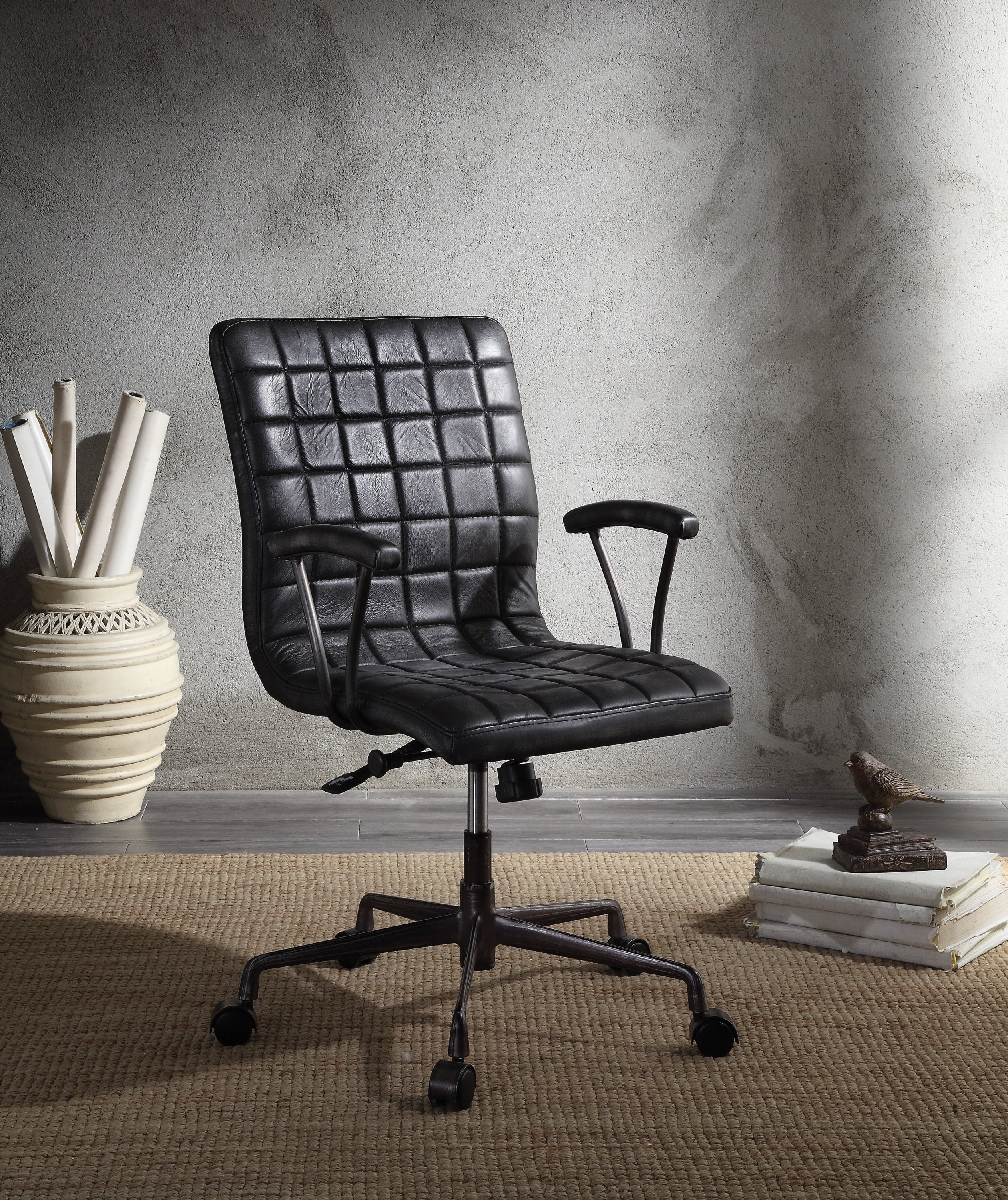 Barack Black Leather Chair - Office Seating with padded seat and backrest, swivel base, and aluminum frame in a modern workspace setting.