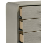 Close-up of Aria chest drawer construction, showing textured front panels, metal handles, and durable ball bearing glides for smooth operation.