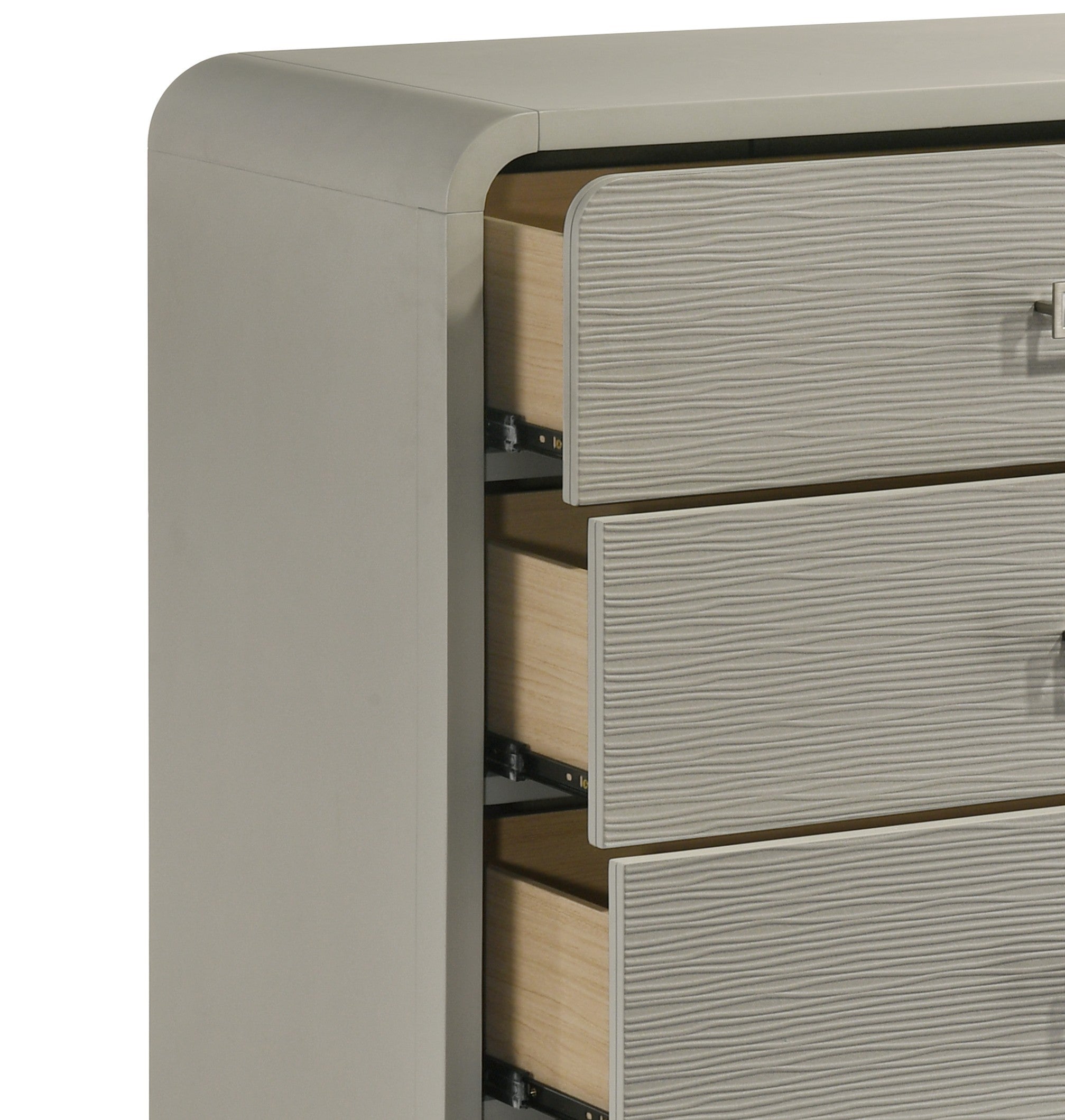 Close-up of Aria chest drawer construction, showing textured front panels, metal handles, and durable ball bearing glides for smooth operation.