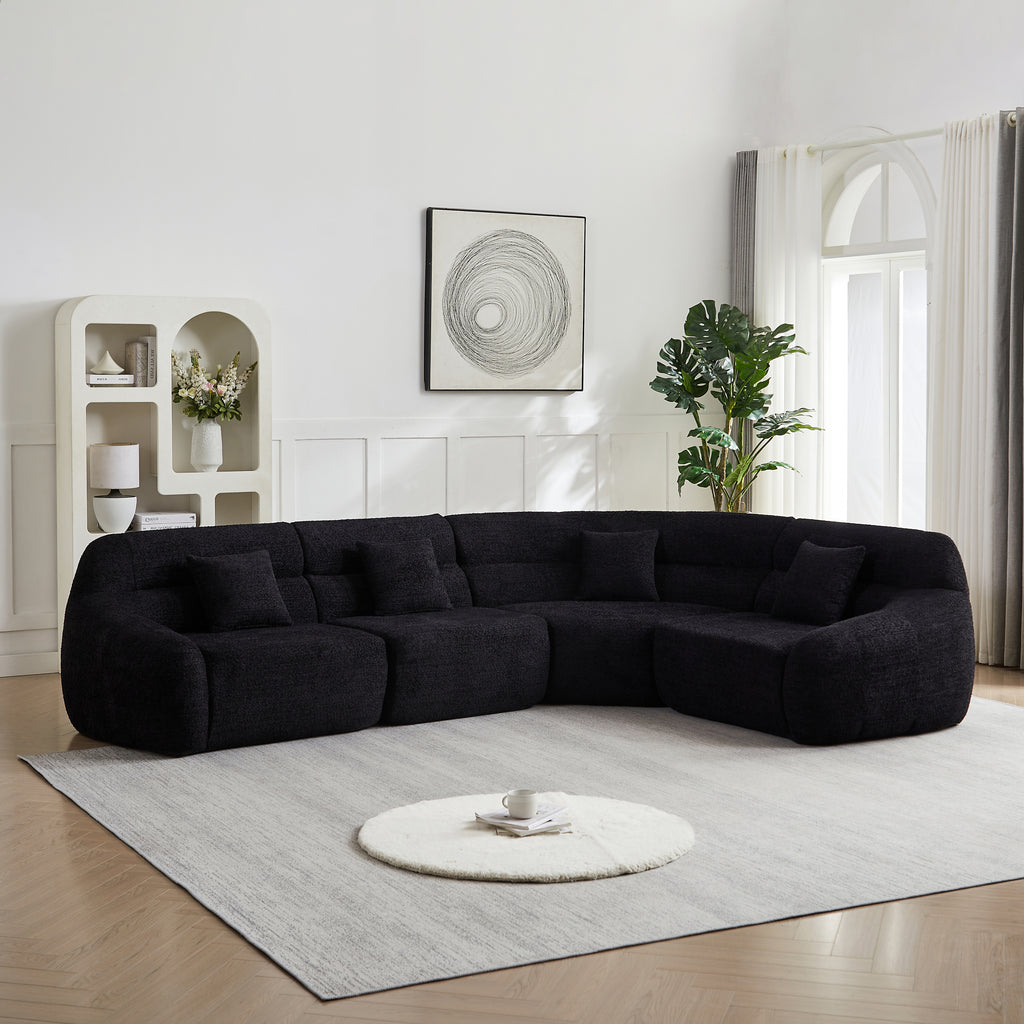 Modern Black Modular Sofa - Luxury Chenille 4-seater with curved 123.2-inch design, placed in a bright living room with minimalist decor.