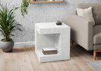 Modern white square accent table with a textured finish, featuring a hollow shelf design for books and storage.