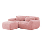 Plush pink modular sofa with chaise, ergonomic design and soft texture, perfect for cozy and stylish living room setups.