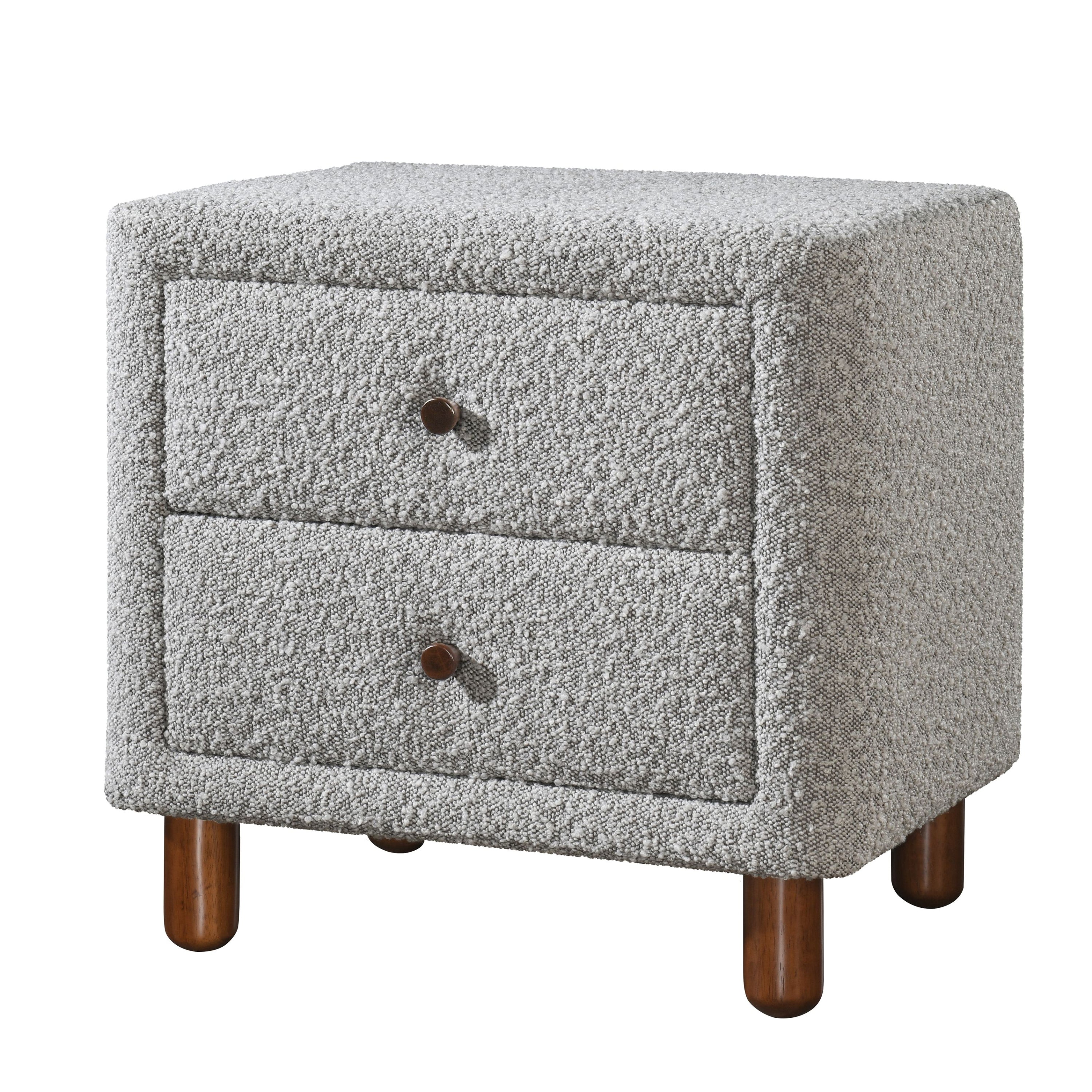 Grey boucle upholstered nightstand featuring two drawers with dark wooden knobs on short, rounded wooden legs.