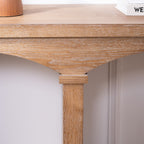 Close-up of the arched leg design and tabletop edge of the Rustic Archway Console Table in natural wood finish.