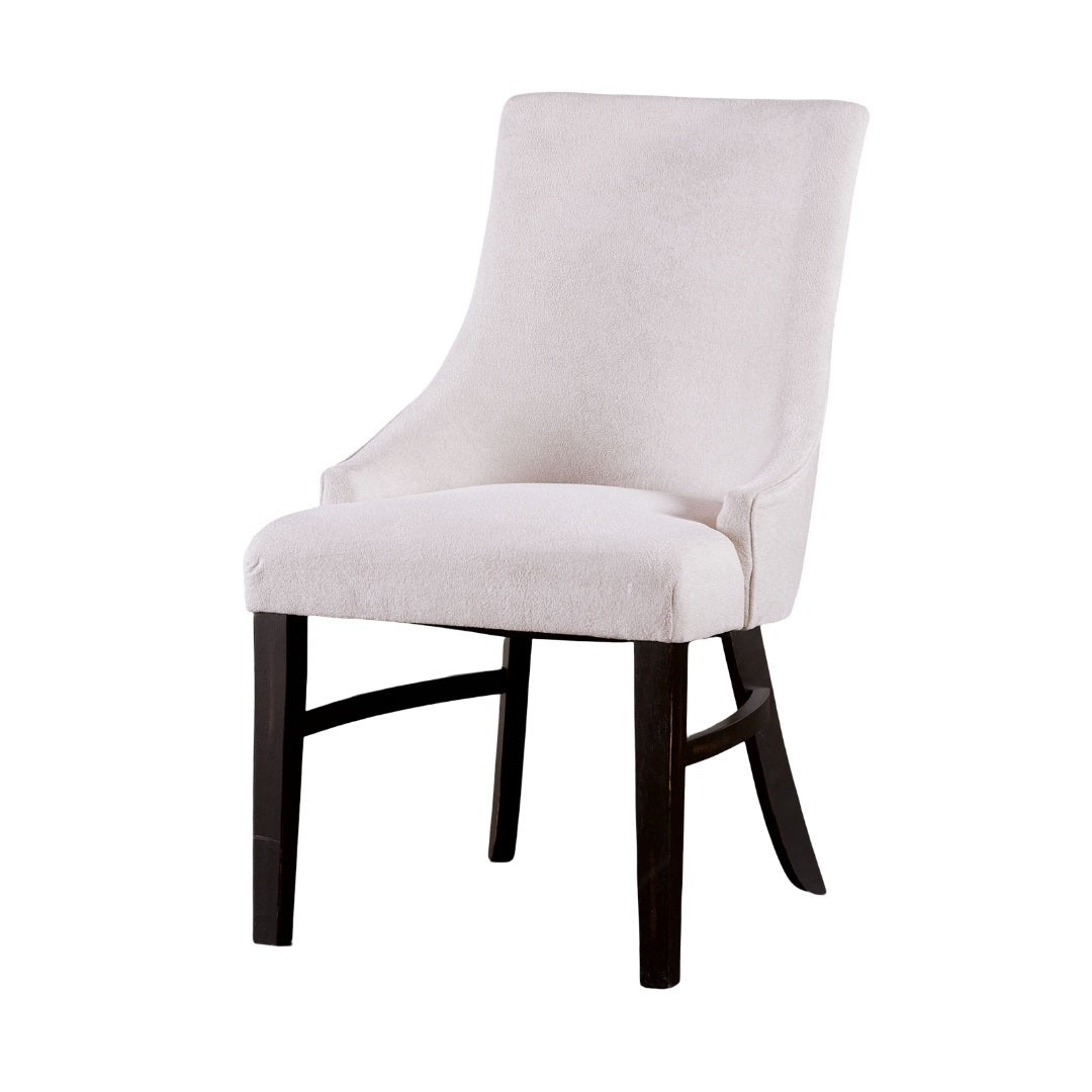 Elegant transitional dining arm chair with soft beige upholstery and dark wood legs, designed for comfort and style.