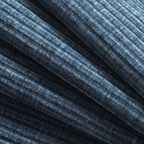 Close-up of textured blue upholstery fabric used on modular sectional sofa, highlighting its soft and durable material.