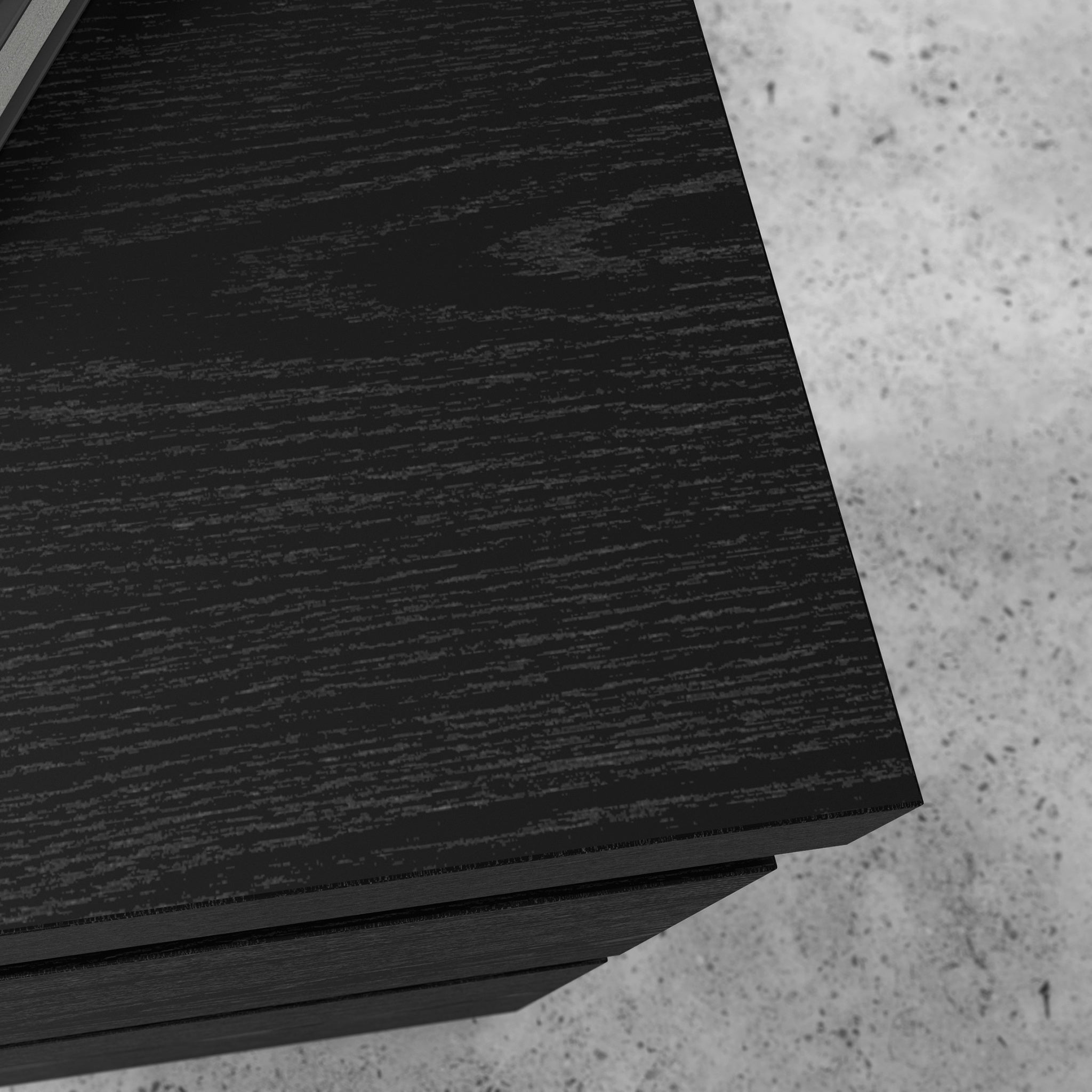 Close-up of L-Shaped Desk Black Finish showing textured engineered wood surface, highlighting its sleek and durable design.
