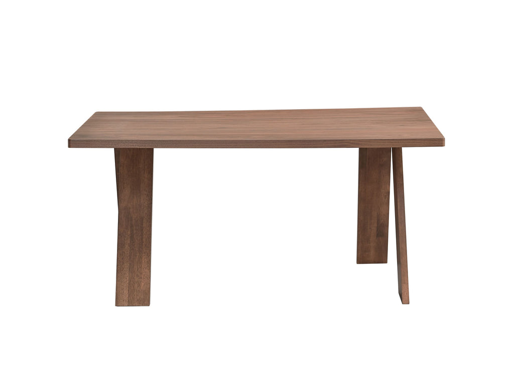 Sarha walnut dining table with angled legs. Minimalist design perfect for modern dining spaces.
