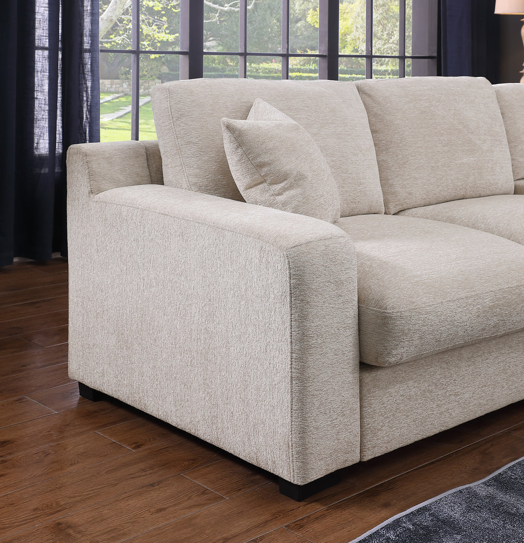 Close-up of armrest and cushion detail on beige chenille corner sectional sofa with plush texture and clean lines.
